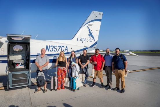 Passengers in front of Cape Air plane