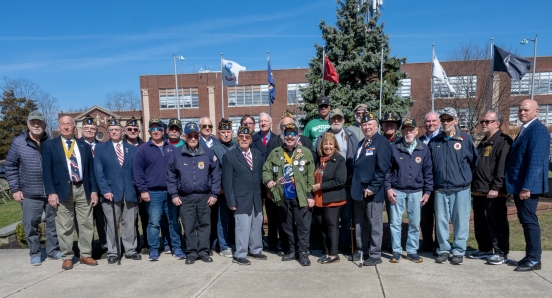 Group photo of electeds and Vietnam Veterans infront of memorial