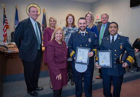 Supervisor Carpenter and the Islip Town Board pose for a photo in the Town Board Room with the honored emergency personnel