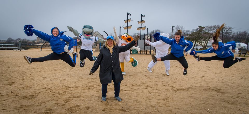 supervisor Carpenter jumps with the cheerleaders at the Polar Plunge