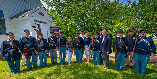 Supervisor Carpenter stands with Councilman O'Connor, Tax Receiver Alexis Weik and the Civil War soldiers at the Living History Event 