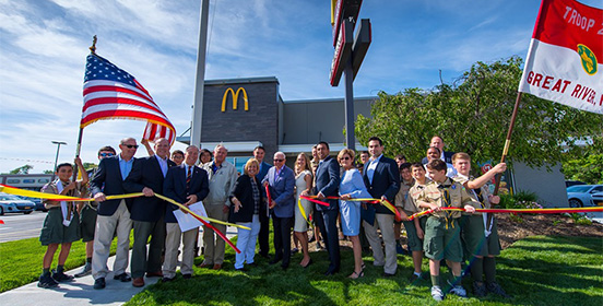Elected officials and community members gather outside the newly re-opened McDonalds in Oakdale