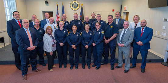 Supervisor Carpenter, Public Safety and Airport Commissioners, and other elected officials poses with the new officers who graduated 