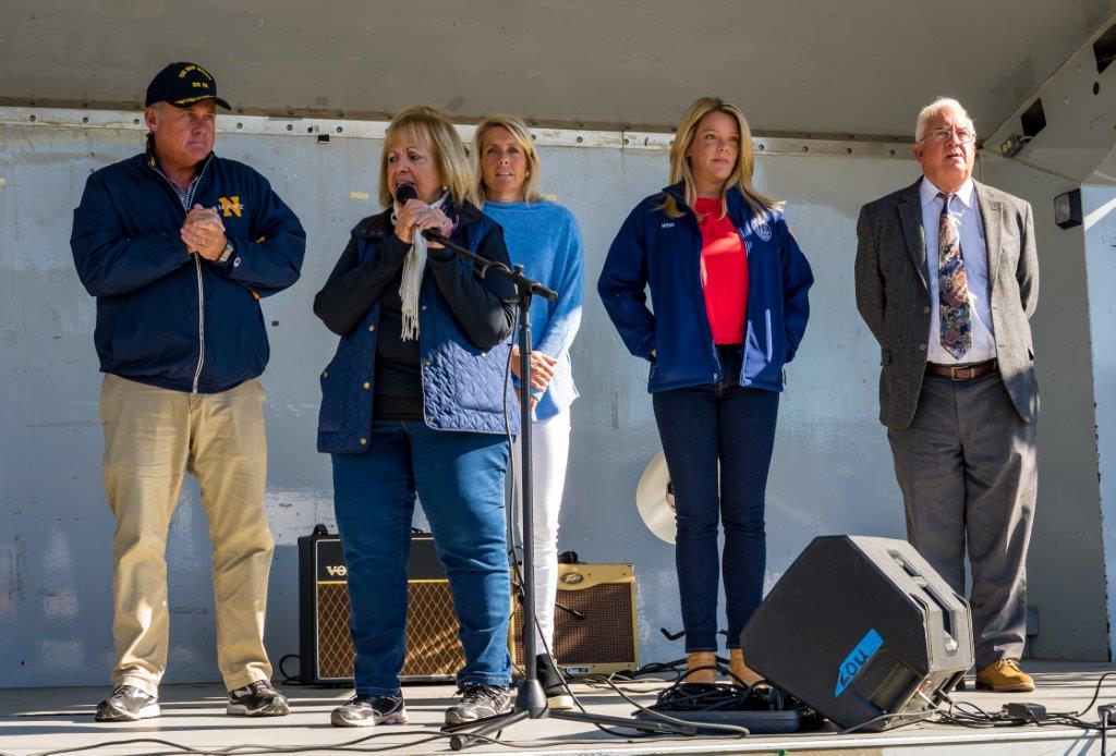 Supervisor Carpenter stands on stage joined by Councilman Cochrane, Councilwoman Mullen, and Receiver of Taxes Alexis Weik as they welcome the festival goers to the Grange.