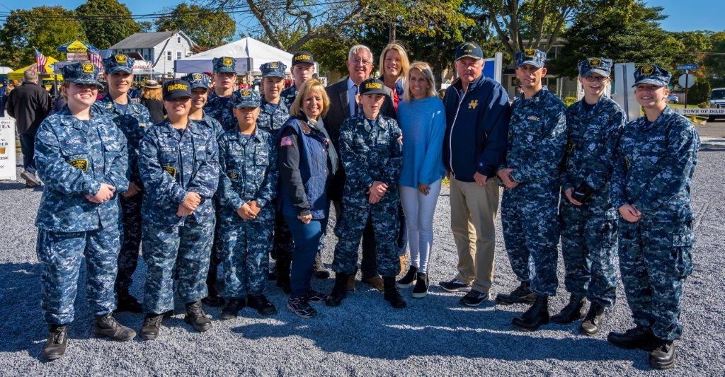 Supervisor Carpenter joined by Councilman Cochrane, Councilwoman Mullen, and Receiver of Taxes Alexis Weik as the US Naval Cadets pose around them for a photo.