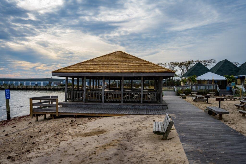 Side view of the pavillion with it's fresh new roof, the sandy shores of Islip Beach beside it.