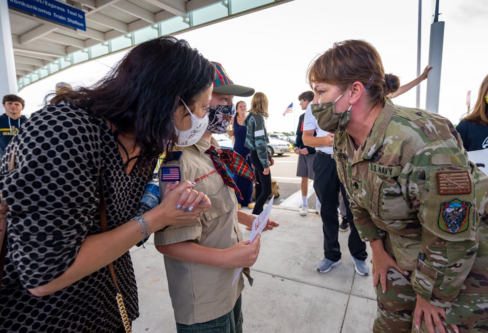 Commander in PPE meets Boy Scout in PPE who turned out to meet her