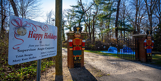 a sign greeting visitors is shown with toy soldiers in the background of the sign welcoming guest to the movie night. 