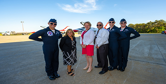 Islip Supervisor and Airport officials stand with pilots of the USAF Thunderbirds 