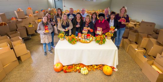  Islip Supervisor Angie Carpenter, Reciever of Taxes Alexis Weik, DPW & Pakrs Commissioner Tom Owens, as well as Parks employees and community volunteers pose for photo infront of the many thanksgiving boxes.
