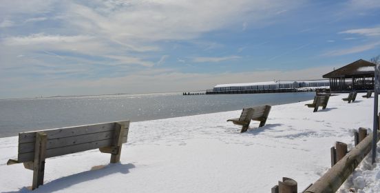snow covers the bay shore marina