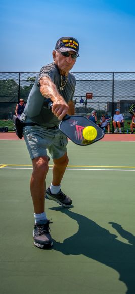 Great form as Joe Gaeta, 96 years old, returns the ball