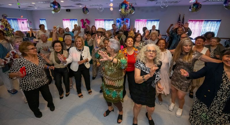 Wide Seniors group shot on dance floor