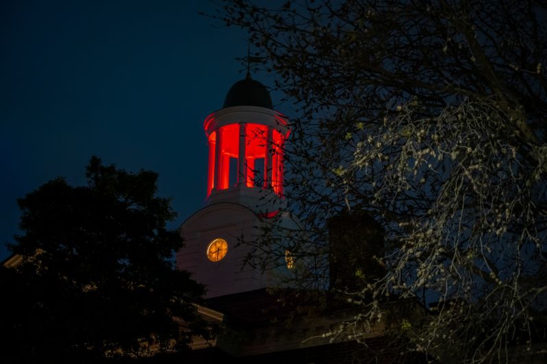 Night shot of Cupola above Town Hall Building glowing red