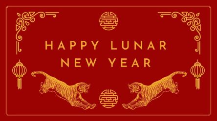 A red banner with gold text and images of tigers with the words Happy Lunar New Year