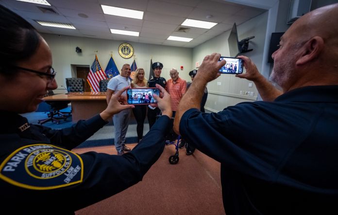 Photo of Camera Phones taking photo of officer graduate