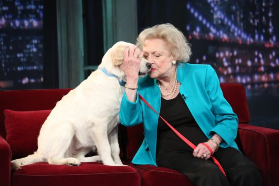 Betty white hugging dog