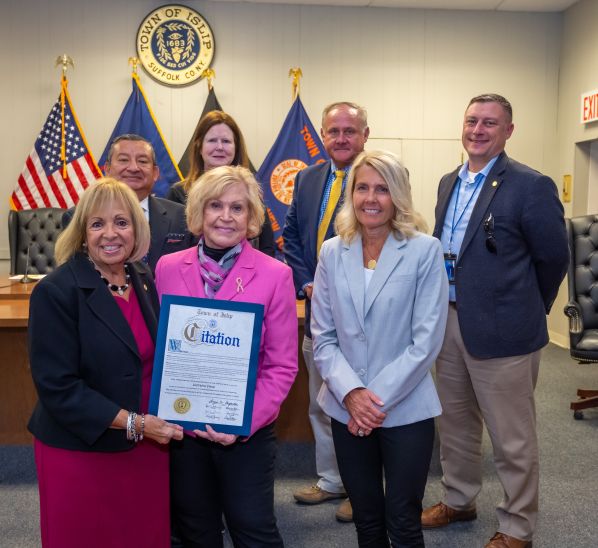 Supervisor Carpenter and the Islip Town Board stand with Lorraine Pace who was honored for her work in mapping breast cancer within the community 