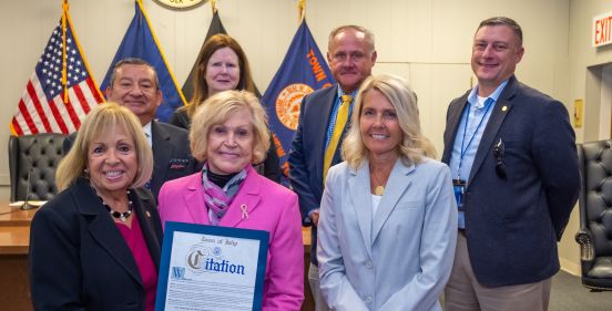 Supervisor Carpenter and the Islip Town Board stand with Lorraine Pace who was honored for her work in mapping breast cancer within the community 