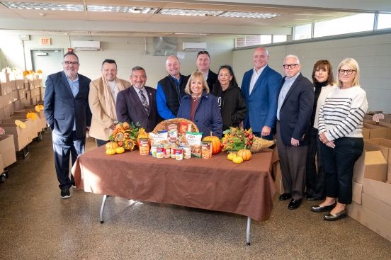 Town Officials in group photo with donated boxes