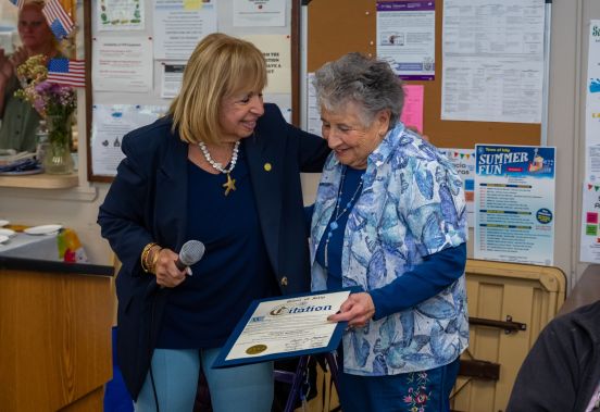 Supervisor handes Carmela Town Citation of Recognition