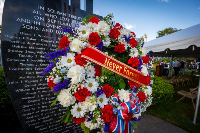 Memorial Wreath placed at Town 9/11 Memorial with the words "Never Forget"