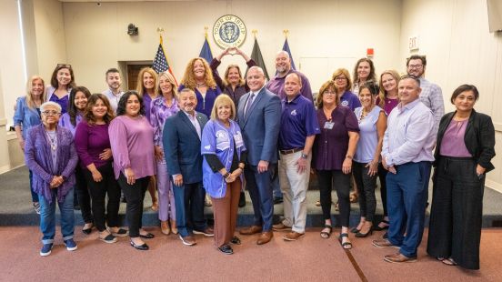 Town Staff in group photo wearing purple