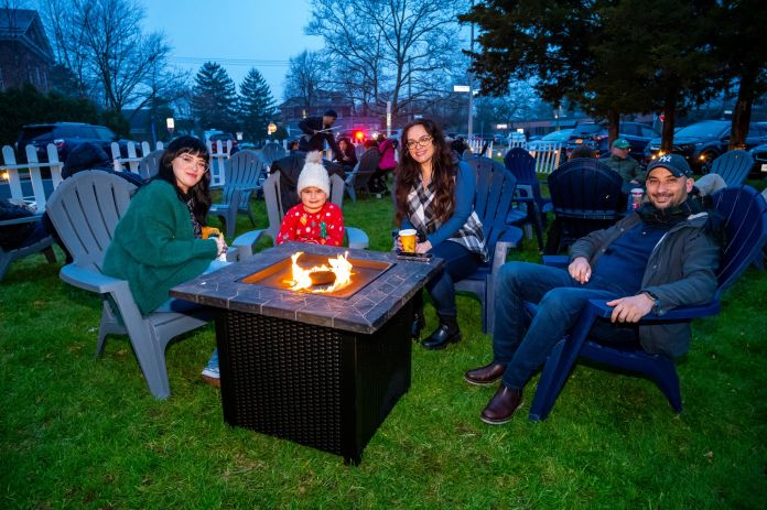 Residents gather around a fire pit