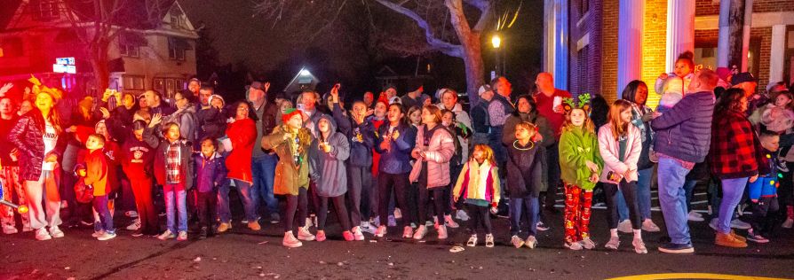 Youthful residents line the streets of Main St. in Islip during parade