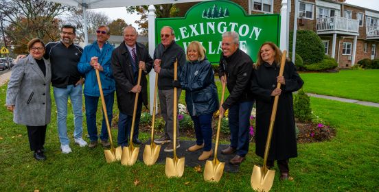 officials gather with shovels to break ground on new sewer project