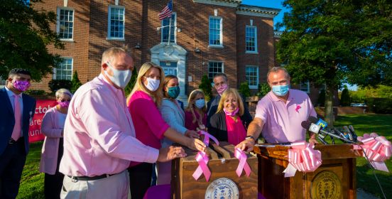 islip elected officials light the town hall coupola pink