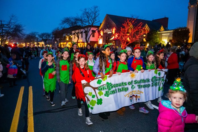 East Islip Girl Scouts dressed in Santa's Elf's costume