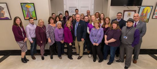 Town employees wearing purple in groupm photo in support of PS I LOVE YOU DAY