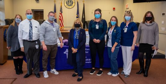 Supervisor, Town and Hospital Officials take group photo all wearing masks