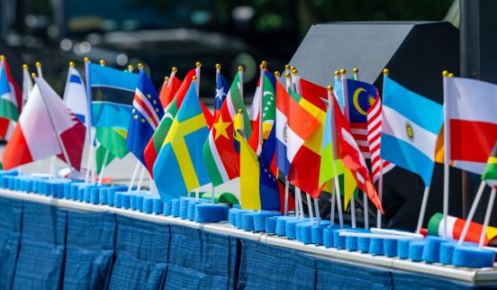 international flags in a row, line the tables