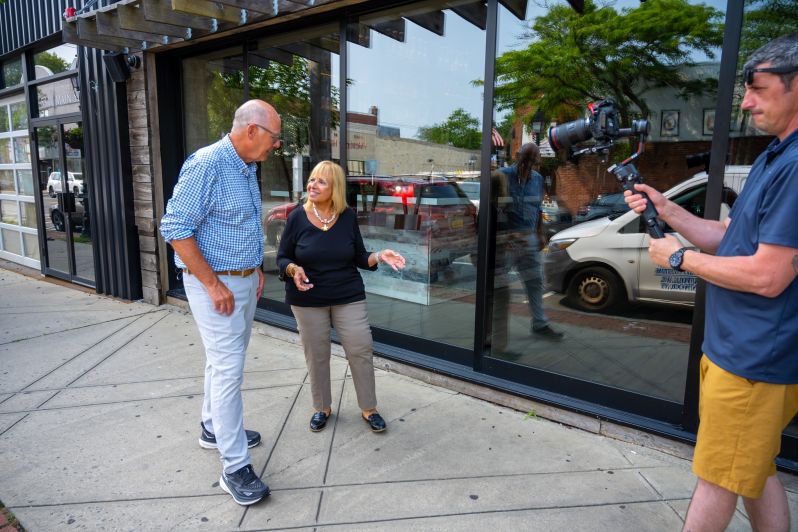 Angie Carpenter and Harry Smith walk and chat along Bay Shore downtown