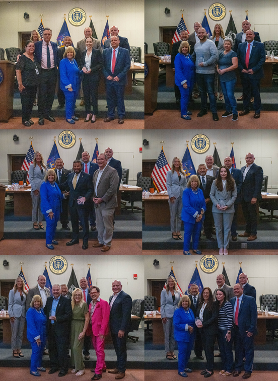 Town board in group photo with honoree