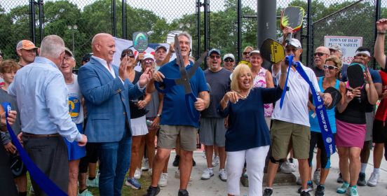 dozens gather as Town Officials cut the ribbon on the new pickleball courts
